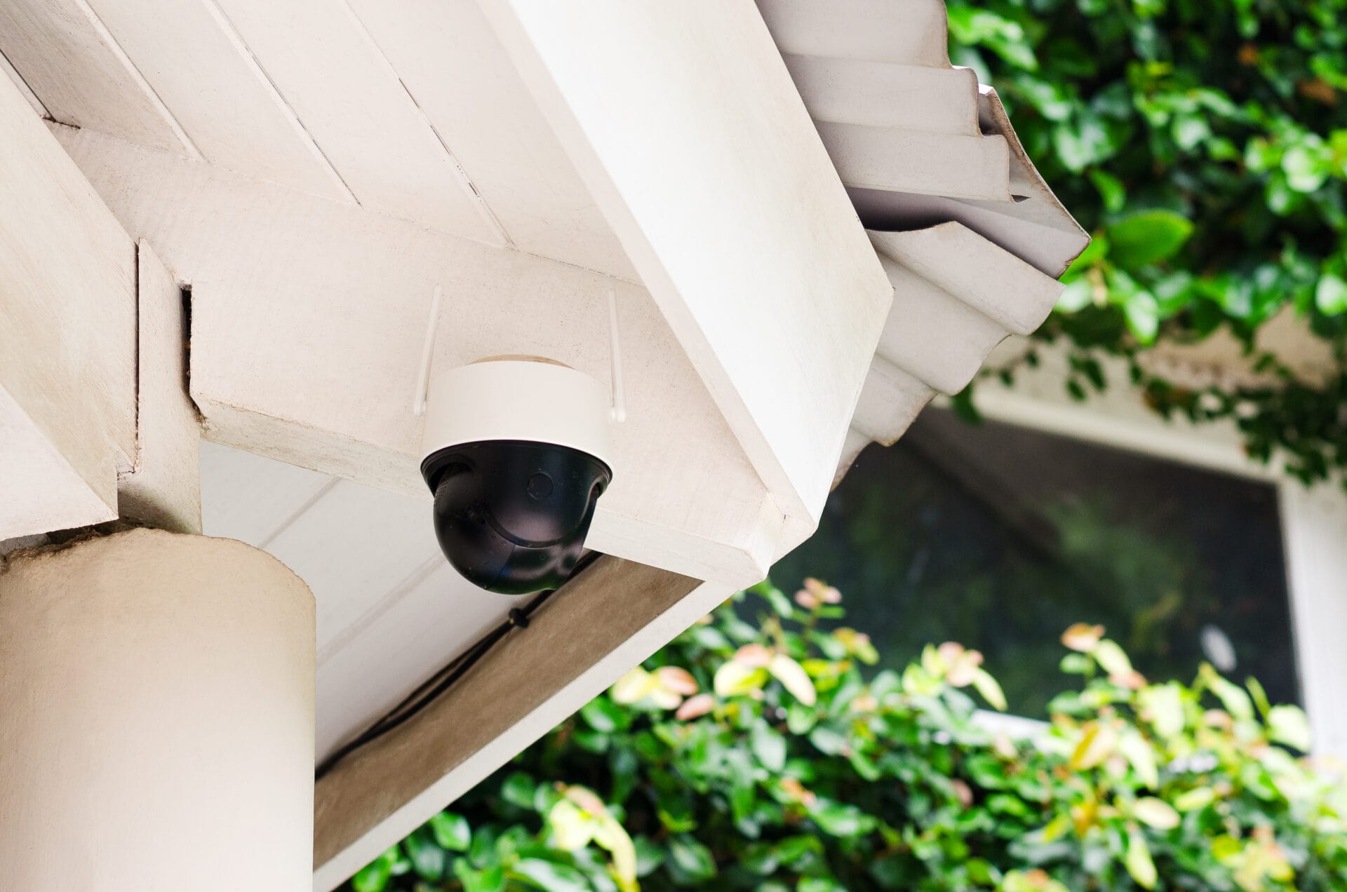 Outdoor security camera mounted on a building exterior